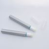 Tubes de brillant à lèvres Orange avec Logo personnalisé de 10ml, cosmétiques vides en plastique avec applicateur de brosse floquée pour le maquillage du visage et du masque