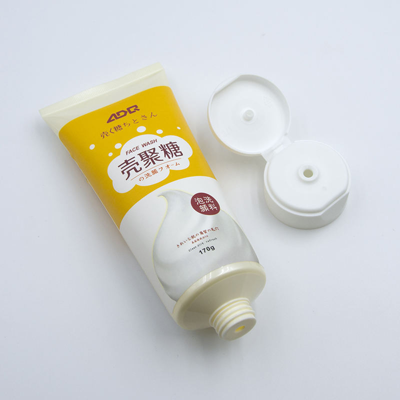 Tube à presser en plastique souple OEM avec couvercle rabattable pour crème pour les mains, lavage du visage, soins de la peau avec surface d'estampage à chaud, lotion cosmétique